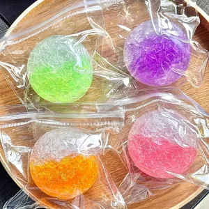 Detailed view of colorful squishy balls with sugar-like texture in clear bags