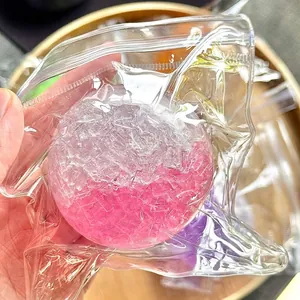 Handmade pink crushed ice texture stress relief squishy ball toy in clear packaging bag