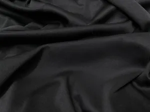 Close-up macro shot showing the fine texture and weave of the black costume fabric.