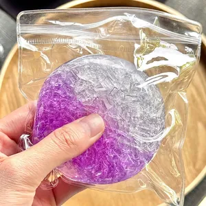Close-up of a purple and clear crushed ice texture squishy decompression toy in a bag