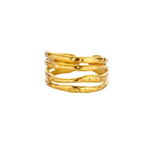 Close-up of a multi-layer hammered gold open ring with a unique organic texture