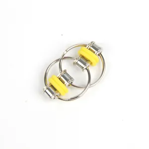 Close-up of stainless steel fidget bike chain toy with yellow silicone rings