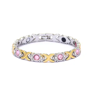 Detailed macro view of bicolor magnetic energy bracelet with pink and clear crystals
