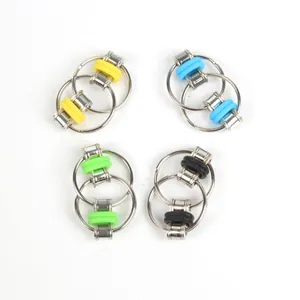 Detail view of four colorful fidget flippy chain link toy keychains on white background
