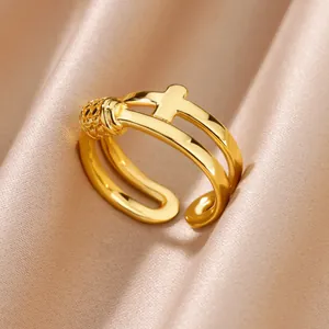 Elegant macro detail of a luxury 18K gold plated stainless steel open ring on soft satin