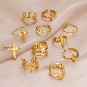 Assortment of 18K gold plated stainless steel adjustable rings with cross and ankh designs