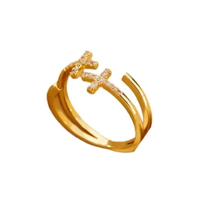 Elegant 18K gold plated stainless steel open ring featuring two sparkling zircon crosses.