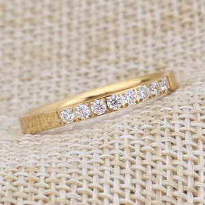 Detailed view of 2mm single row 18K gold plated stainless steel ring with sparkling stones