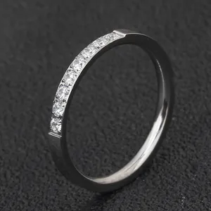 Close-up detail of a 2mm minimalist stainless steel eternity ring with single row stones.