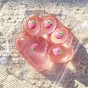 Large pink strawberry cat paw squishy toy for stress relief and cute desk decoration