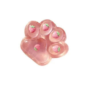 Jumbo pink translucent strawberry cat paw squishy toy for stress relief and fun playtime
