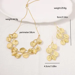 Detailed view of gold leaf necklace and earrings with weight and size measurements