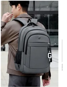 Large capacity grey Oxford cloth backpack worn by model for school and travel
