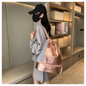 Detail of rose gold gym bag featuring dry-wet separation and shoe compartment design