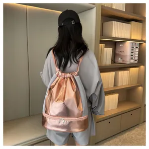 Rear view of rose gold metallic gym bag with wet-dry separation compartment