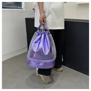 Close-up of metallic purple gym bag with shoe compartment and side mesh details.