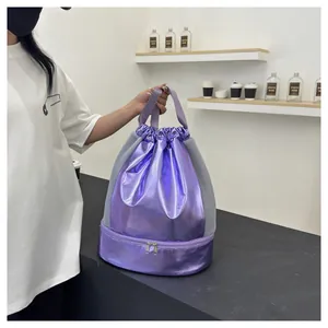 Close-up of a purple metallic dry-wet separation gym bag with mesh sides and shoe compartment