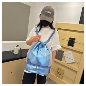 Stylish blue metallic gym backpack with shoe compartment shown being worn by a model