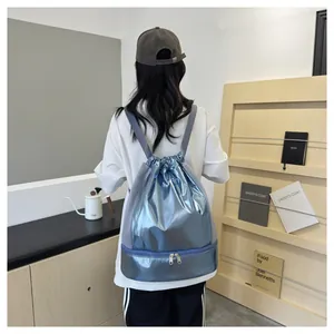 Back view of a shiny metallic blue gym backpack featuring a separate shoe compartment