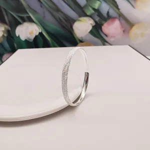 Elegant frosted silver-tone open cuff bangle with starry texture for women's gift.