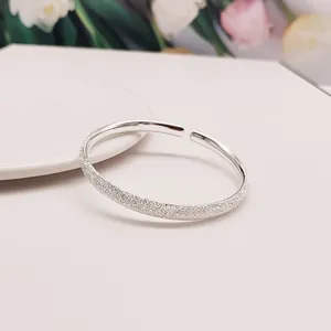 Elegant frosted open bangle bracelet with a shimmering sandblasted finish for women.