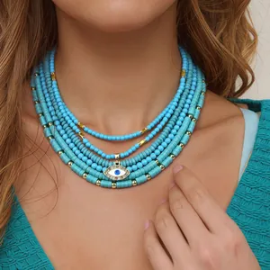 Collana di perle turchesi a più strati con pendente malocchio dorato per donna