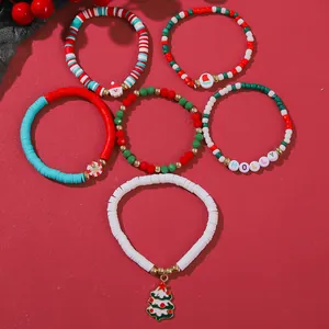 Christmas bracelet set featuring Santa, tree charms and 'HOLLY' beads on red
