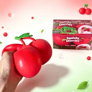 Macro view of jumbo red cherry squishy toy being squeezed to show slow rebound texture