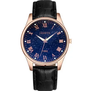 Detail of a minimalist quartz watch with blue starry dial and rose gold case