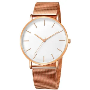 Detailed view of minimalist rose gold mesh belt quartz watch with white dial