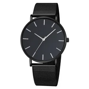 Detailed view of a minimalist black quartz watch with a metal mesh strap and silver indices