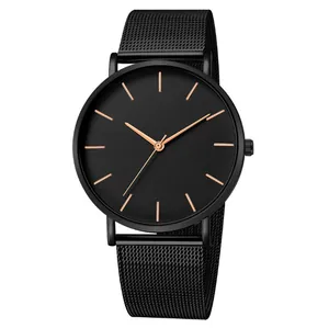 Detailed view of a minimalist black mesh belt quartz watch with rose gold hands