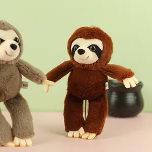 Close-up of cute sloth plush pendant charm showing soft fuzzy texture and detail
