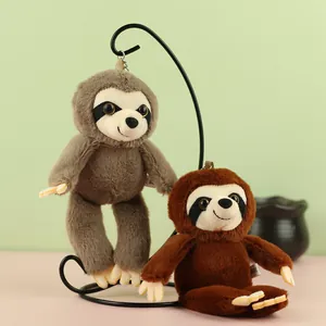 Set of two adorable plush sloth keychains in brown and grey hanging on a metal stand