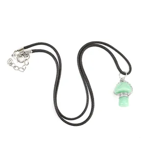 Handmade wire-wrapped green crystal mushroom pendant necklace with black cord