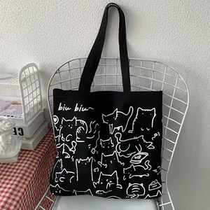 Bolso tote grande de lona negra con adorables ilustraciones de gatos blancos a mano