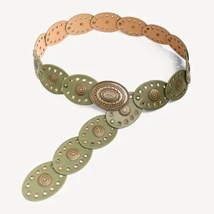Detailed close-up of green Bohemian punk belt featuring oval bronze metal plates and studs
