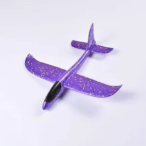 Detailed top view of a purple foam glider toy with yellow speckled pattern design