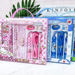 Detailed view of pink Hello Kitty and blue Doraemon cartoon stationery gift sets