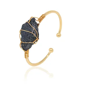 Handmade wire wrapped gold plated cuff bracelet with natural raw black crystal