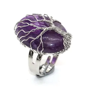 Close-up of handmade purple amethyst tree of life adjustable silver wire wrap ring.