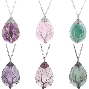 Detailed view of six handmade wire-wrapped tree of life waterdrop crystal pendants