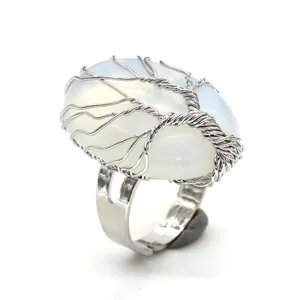 Detailed shot of the Tree of Life wire-wrapped ring with an oval opalite stone.