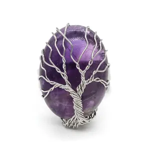 Close-up detail of a silver wire wrapped amethyst tree of life adjustable open ring