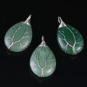Handmade wire wrapped Tree of Life natural stone water drop pendants on black background