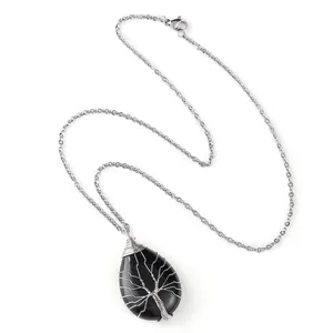 Handmade Tree of Life necklace with wire-wrapped teardrop black natural stone pendant.