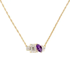 Elegant gold necklace with emerald-cut clear stone and purple marquise amethyst pendant.
