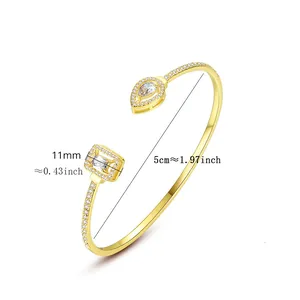 Detailed measurements of gold-plated open bangle with pear and emerald cut zircons