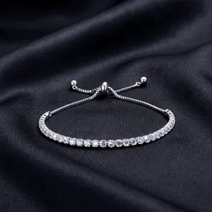 Close-up of silver tennis bracelet with sparkling 5A cubic zirconia and adjustable closure.