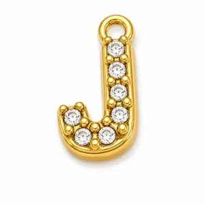 Close-up of a gold-plated letter J pendant featuring sparkling cubic zirconia crystals.